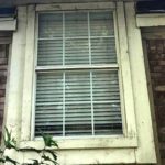Signs of exterior paint wear on house