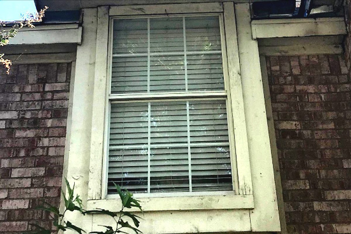 Signs of exterior paint wear on house