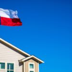 Texas State Flag the Symbol of the Lone Star State above Modern Brand New Suburban Home